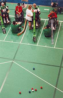 three people playing boccia